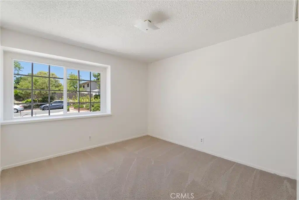 Empty room with a large window with grids in California