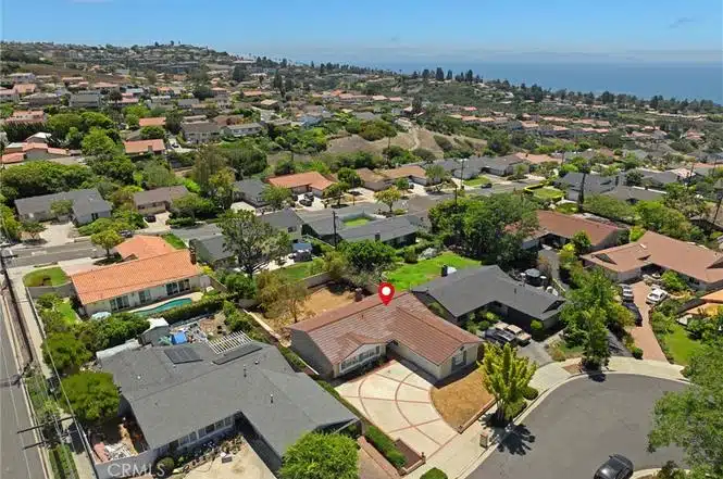 Aerial view of a suburban neighborhood near the ocean in California.