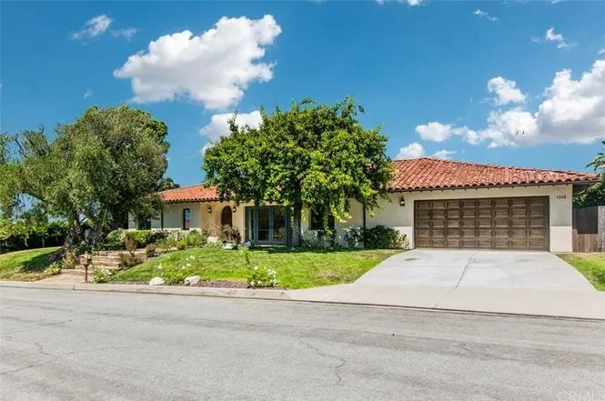Real estate single-story house with red-tiled roof in California